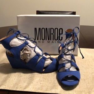 Royal blue wedge sandals.